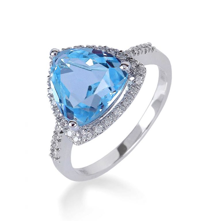 Anello in oro 750‰  con tapazio azzurro centrale e contorno di diamanti